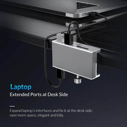 ORICO Clip-Type USB 3.0 Hub with 2 Ports and SD Card Reader clipped to desk extending laptop ports with USB devices and SD card access