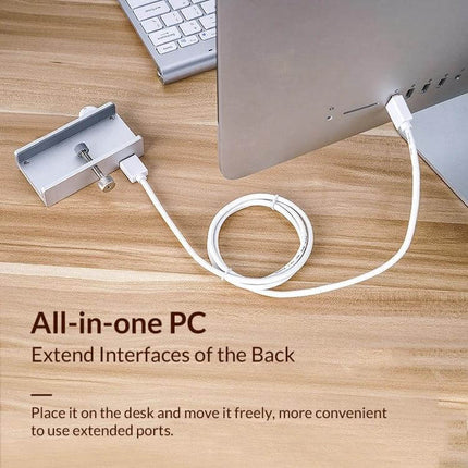 ORICO Clip-Type USB 3.0 Hub with 2 Ports and SD Card Reader clipped to monitor, white cable and SD card slot visible