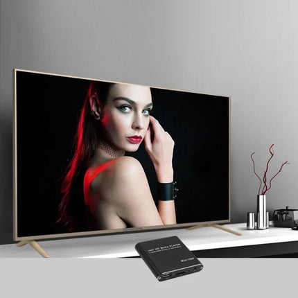Mini Portable Media Player for USB and SD Card Playback connected to TV showing movie for travel and student use