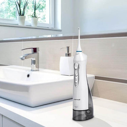 Mornwell USB Rechargeable Water Flosser for Daily Oral Hygiene on bathroom counter showing compact handle, USB charging and three modes for gentle gum massage