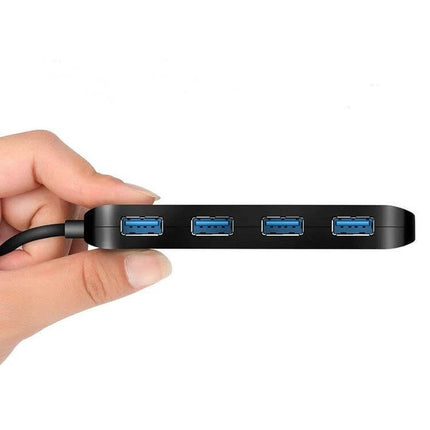 USB 3.0 4-Port Hub with Individual Switches for Multiple Devices — slim black hub showing four blue USB 3.0 ports, held in hand for scale