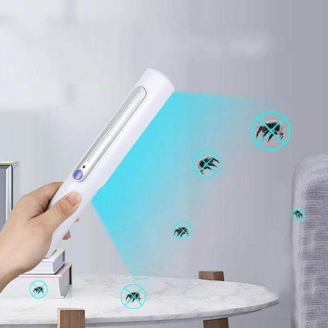 Portable Handheld UV Disinfection Lamp For Home And Travel being used over a table and sofa to sanitize surfaces with blue UV-C light