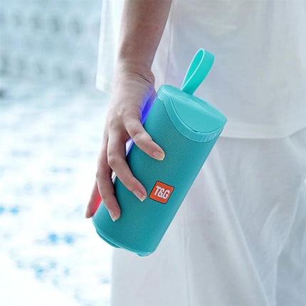 TG Portable Bluetooth Speaker For Outdoor Gatherings And Home Use turquoise portable speaker held by hand with strap and Bluetooth light