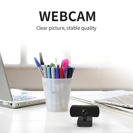 C3 Webcam for Video Conferences and Live Broadcasting on desk with laptop, auto light enhancement and built-in microphone for clear calls