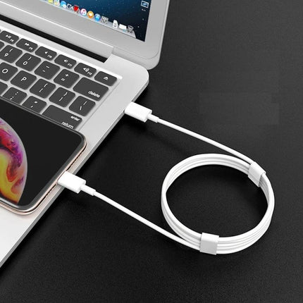 Charging Cable for Everyday iPhone Use at Home and on the Go — 18W fast charging white cable connected between iPhone and laptop