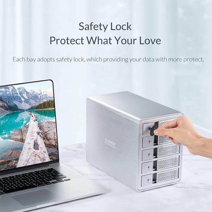 Orico 3.5-Inch Multi-Bay Hard Drive Enclosure in Black showing hand locking a bay on aluminum multi-bay unit next to laptop