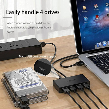 ORICO 4-Port USB 3.0 Hub for Connecting Multiple Devices connected to laptop with four external drives and cables