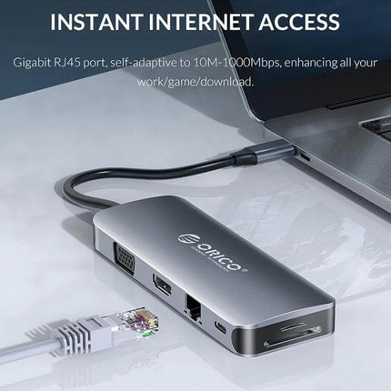 Orico 11-in-1 Multifunction Docking Station for Device Connectivity shown connected to a laptop with Ethernet, HDMI, VGA and card reader ports
