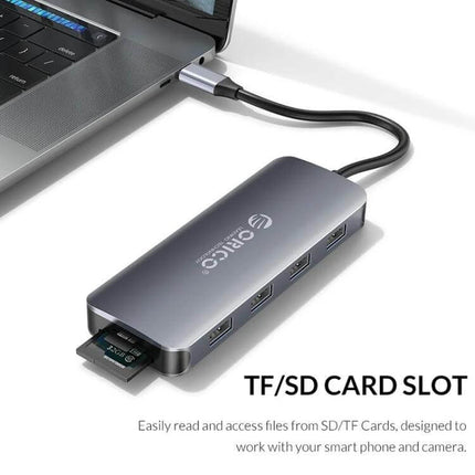 Orico 11-in-1 Multifunction Docking Station for Device Connectivity connected to laptop with SD/TF card slot and multiple USB ports, aluminum finish