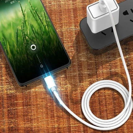 A Handy USB to Micro USB Cable for Daily Device Charging connected to a smartphone on a wooden desk, showing charging and data sync