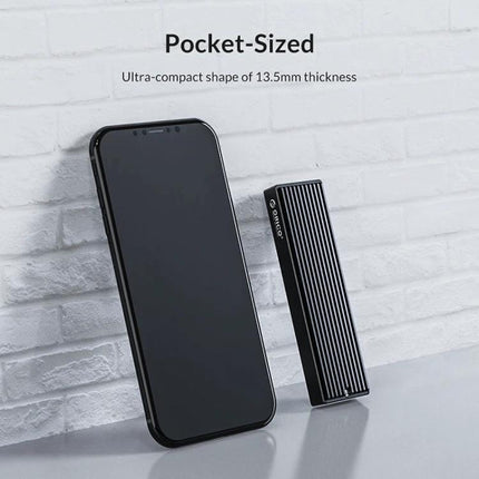 ORICO M2PV-C3 Enclosure for M.2 NVMe SSD External Use pocket-sized aluminum NVMe enclosure next to smartphone