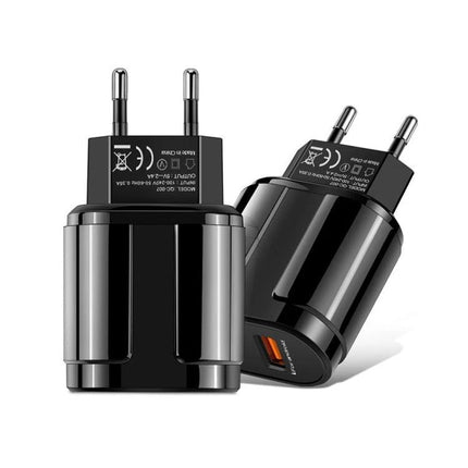 Compact Dual USB Charger for Travel and Daily Use - black dual-port travel wall charger powering phone and tablet