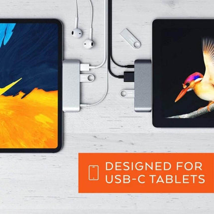 Versatile 4-in-1 USB-C Hub for Video and Presentations connected to two tablets with headphones and USB drive for on-the-go meetings