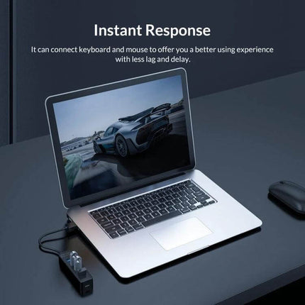 Orico Black 7-Port USB Hub for Connecting Multiple Devices Daily shown powering laptop, keyboard and mouse for instant response