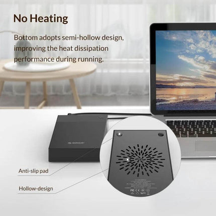 Orico 3.5-Inch Portable External Hard Drive Enclosure showing anti-slip pads, hollow bottom design for heat dissipation next to a laptop