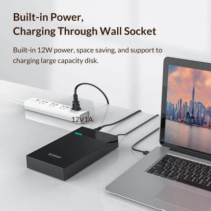 Orico 3.5-Inch Portable External Hard Drive Enclosure connected to laptop and wall socket showing built-in 12W power for charging and data transfer