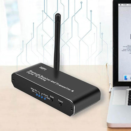 3-in-1 Bluetooth Receiver, Transmitter, and Digital to Analog Converter black desktop unit with antenna next to laptop for wireless audio
