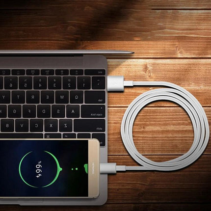 Three-Meter USB to Type-C Cable for Daily Device Charging Needs - white TPE cable charging phone from laptop on wooden desk