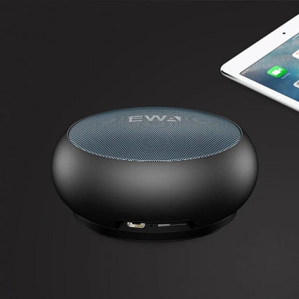 EWA Portable Bluetooth Speaker For Everyday Use With Water Resistant Mesh compact black metal mesh speaker next to tablet
