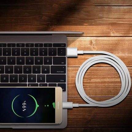 Practical 2-Meter USB to USB-C Cable for Everyday Device Charging — 2m white cable charging smartphone from laptop on wooden desk