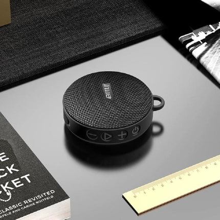 Compact Bluetooth Speaker With Bike Mount For Outdoor Use shown clipped, zinc alloy frame, IPX7 waterproof, dust‑proof mesh