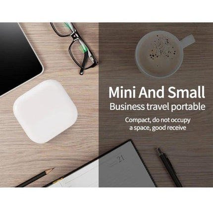 Compact Folding Charger for Travel and Daily Essentials — mini white folding charger on desk with glasses, notebook and coffee