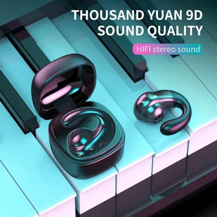 Single-Ear Bone Conduction Wireless Earphone For Commuting shown with charging case on piano keys, discreet single-ear design