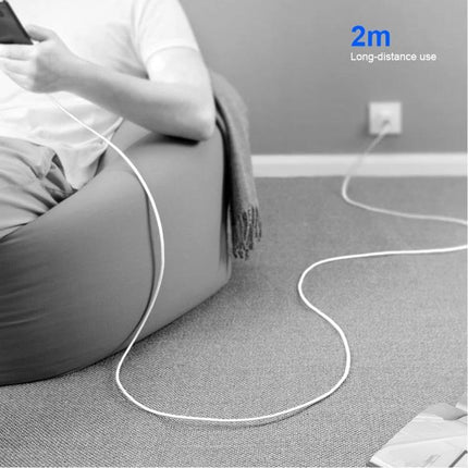 Folding Travel Charger Set for Everyday Charging Needs shown charging a smartphone from a wall outlet with a 2m cable while seated
