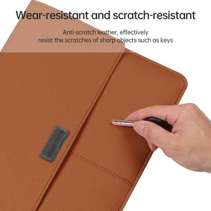 Waterproof Litchi Pattern PU Leather Laptop Bag for 13-14 Inch Devices shown in tan resisting a key scratch on the surface