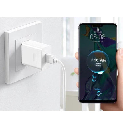USB Travel Charger with Cables for On-the-Go Device Charging plugged into wall charging a smartphone with 66% battery