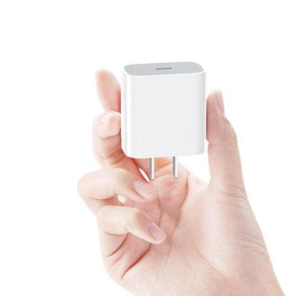 Essential Travel Charger Set for Daily Mobile Use compact 20W PD charger with 8‑pin cable shown in hand for travel charging