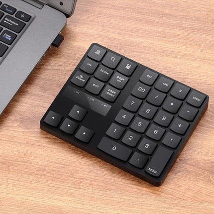 Wireless Numeric Keypad for Efficient Laptop Data Entry - compact 35-key wireless keypad for fast spreadsheet and accounting input