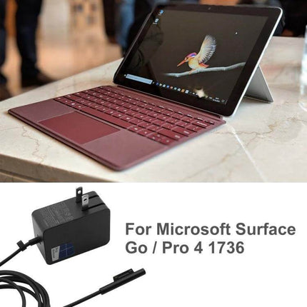 Microsoft Surface AC Adapter for Charging Go and Pro 4 Devices plugged into Surface Go with magnetic connector and replacement power brick