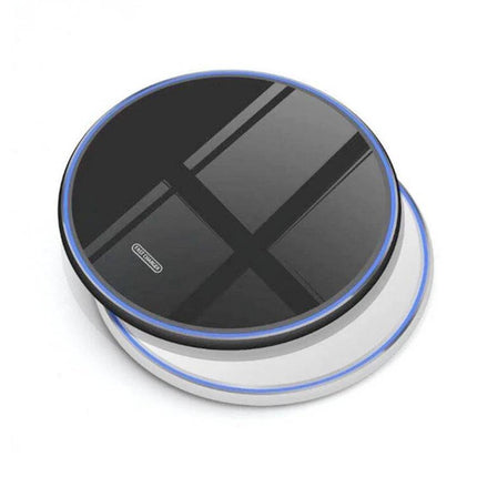 Sleek Mirror Wireless Charger for Daily Home Phone Use on a nightstand, mirror-finish round wireless charging pad with blue LED edge