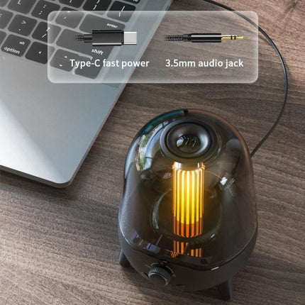 Night Light Speaker With Soothing Breathing Light For Bed on desk by laptop showing Type-C and 3.5mm audio jack connections