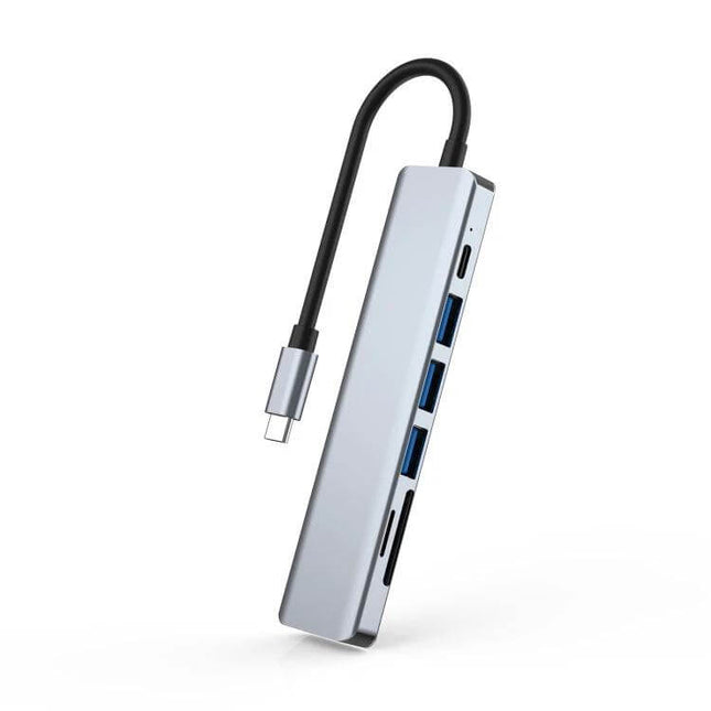 Versatile 7-in-1 Type-C Docking Station for Laptops and Peripherals in silver with multiple USB-A, SD card and HDMI ports