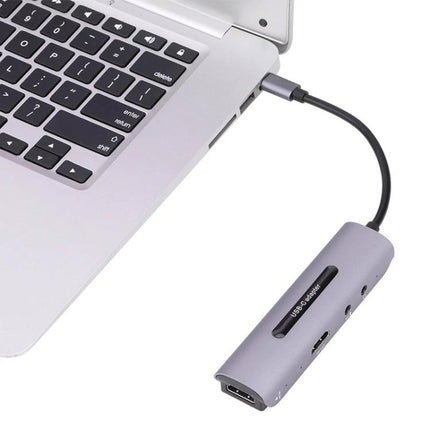 USB HDMI Video Capture Card for Live Streaming and Recording shown connected to laptop capturing HDMI source for streaming and recording