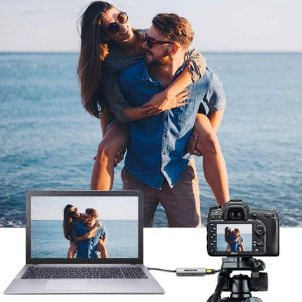 USB HDMI Video Capture Card for Live Streaming and Recording showing camera connected to laptop capturing couple at the beach