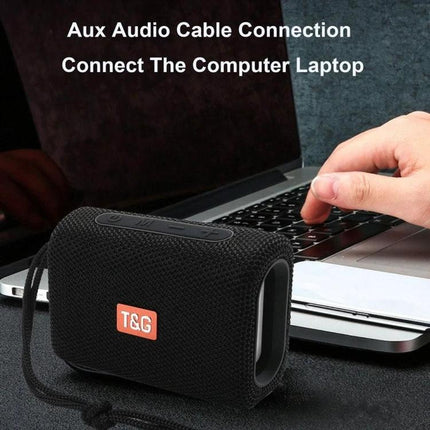 T G Compact Bluetooth Speaker For Outdoor Walks Picnics And Hikes shown connected to a laptop via aux for outdoor use