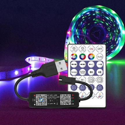 LED Light Strip Controller With Bluetooth App Remote shown with USB power cable, IR remote and RGB LED strip glowing in multicolor