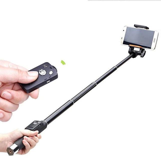 Selfie Stick for Capturing Everyday Moments with Phones shown extended with phone mounted and Bluetooth remote
