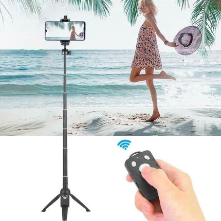 Yunteng Handheld Tripod For Daily Smartphone Photography showing tripod-selfie stick with wireless remote on beach