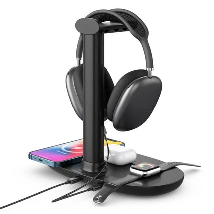 Convenient Stand for Charging Phone and Accessories at Home showing phone, earbuds, smartwatch and headphones on a tidy wireless charging stand
