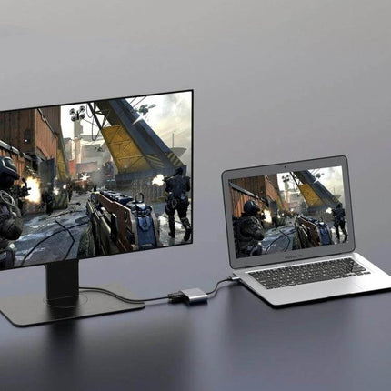 USB 3.0 Adapter for HDMI, VGA, and Audio Device Connections showing laptop mirrored to external monitor for gaming and work