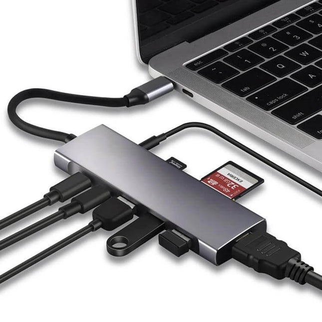 USB-C 9-in-1 Multi-Port Hub for Video, Data, and Charging Connections connected to laptop with HDMI, USB, SD card and charging cable