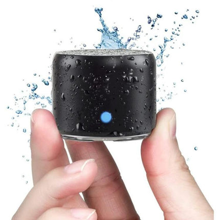 Compact Portable Bluetooth Speaker For Travel And Home Use showing waterproof black stainless steel mini speaker held in hand