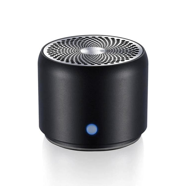 Compact Portable Bluetooth Speaker For Travel And Home Use showing black stainless steel cylinrical speaker with blue LED