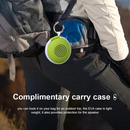 Compact Portable Bluetooth Speaker For Travel And Home Use hanging on backpack with stainless steel body and etched finish