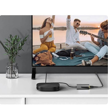 USB-C Ethernet Adapter for Reliable Wired Internet Connections plugged into TV setup showing streaming and outdoor friends scene