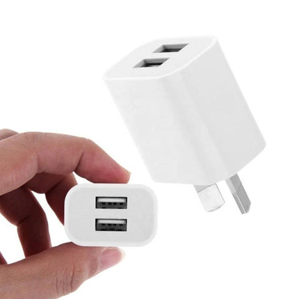Essential Dual Port USB Charger for Daily Device Needs - compact white dual USB wall charger powering two phones or tablets